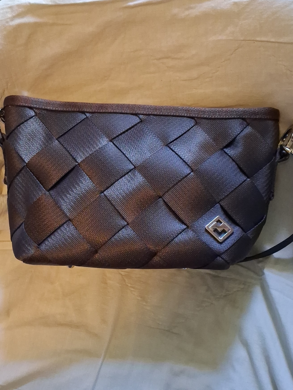 Woven Seatbelt Bag in Dark Brown By MAGGIE BAGS.